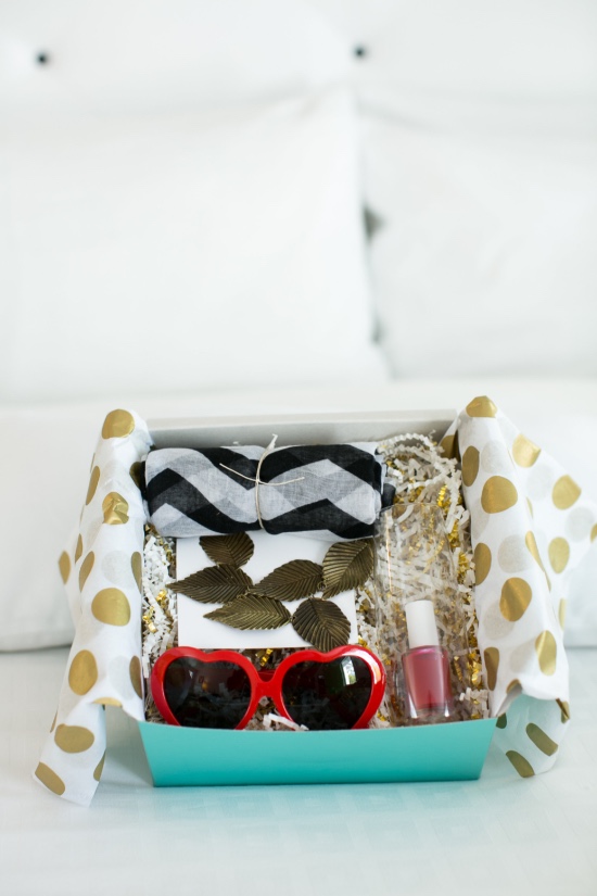 Gift box with sunglasses scarf and nail polish