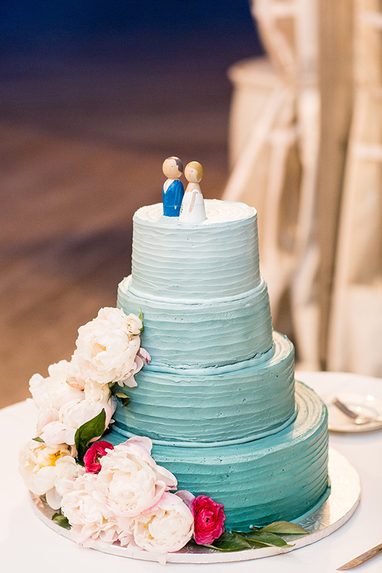 Elegant tiered wedding cake with floral accents