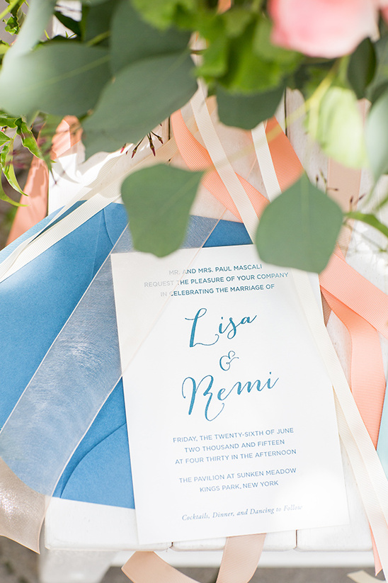 Elegant wedding invitation with blue and peach accents