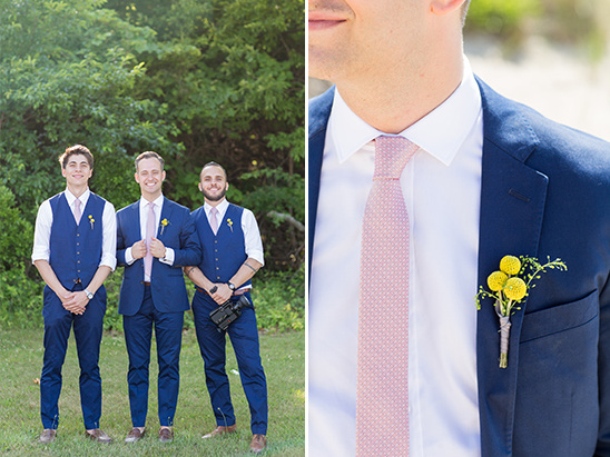 Groomsmen in blue suits pink ties and yellow flowers