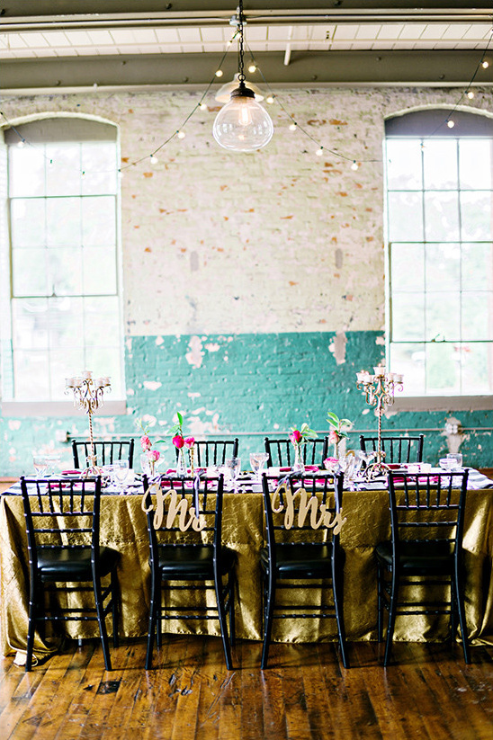 Elegant wedding reception table decor with Mr Mrs chairs