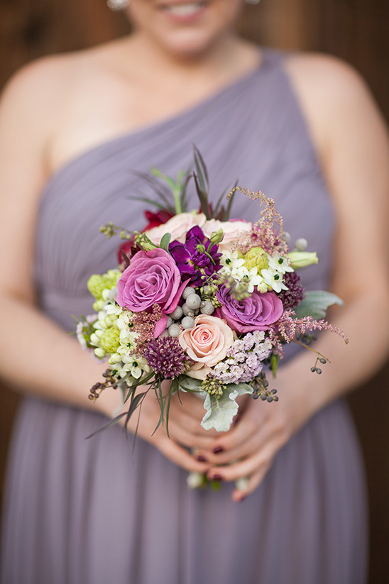 Purple and pink bridesmaid bouquet with various flowers