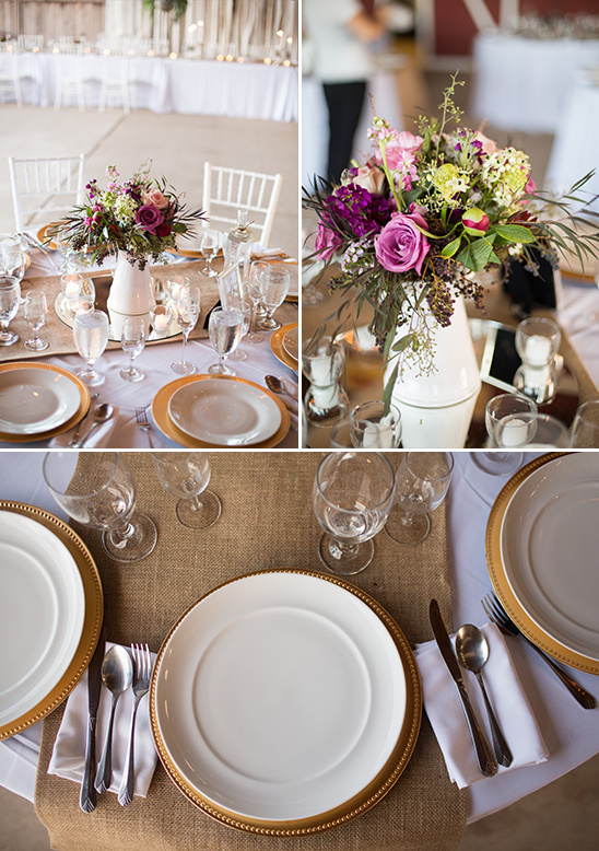 Rustic wedding table setting with gold chargers and floral centerpiece