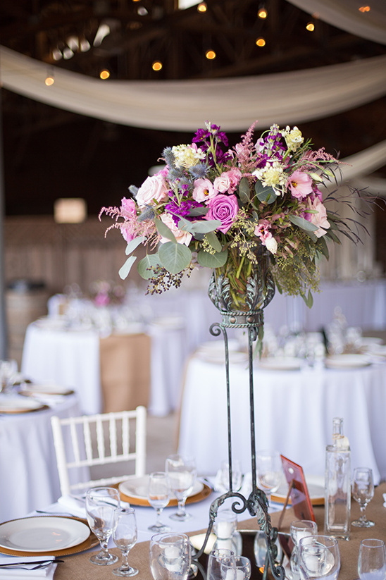 Elegant wedding centerpiece with roses and eucalyptus