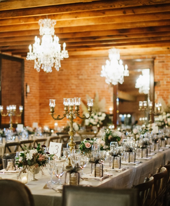 Elegant wedding reception with chandeliers and tablescapes
