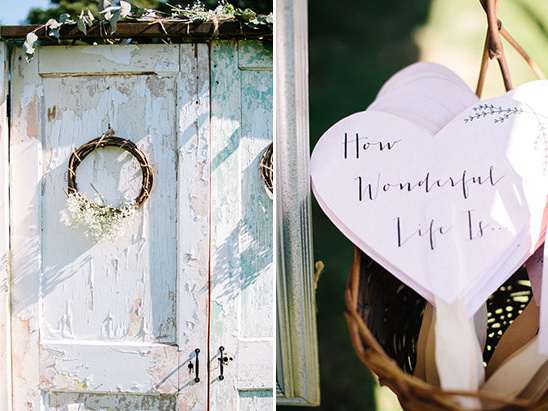 Rustic door with floral wreath; heart-shaped How Wonderful Life Is fans