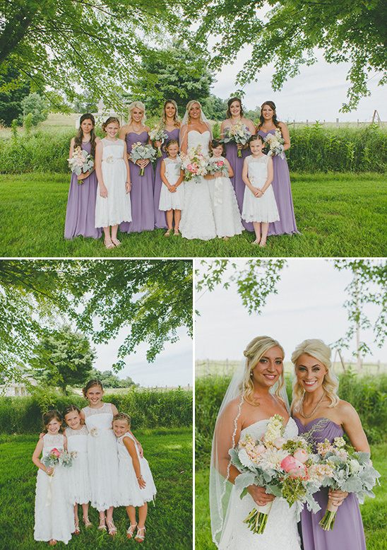 Bride with bridesmaids in lavender and flower girls outdoors