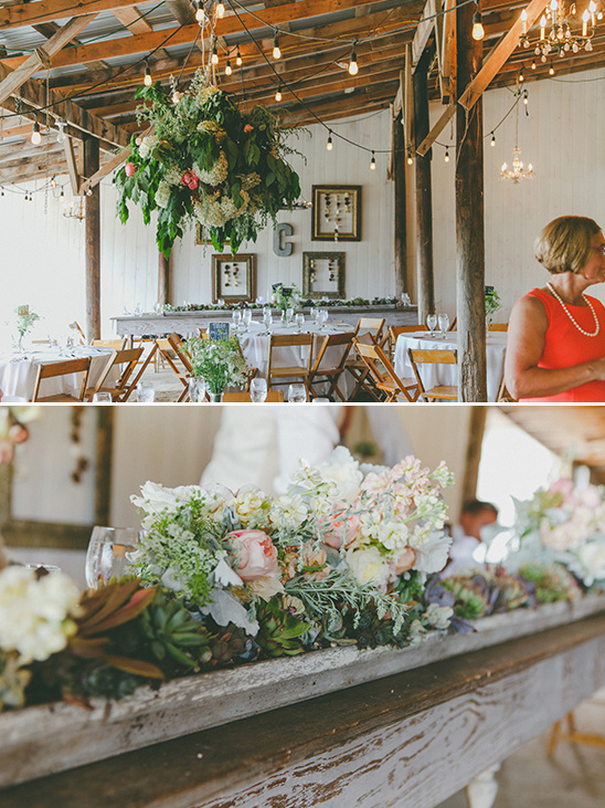 Rustic barn wedding decor with floral arrangements