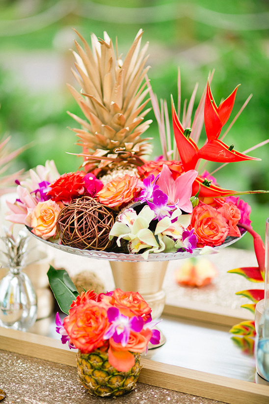 Colorful tropical flowers golden pineapple centerpiece decor