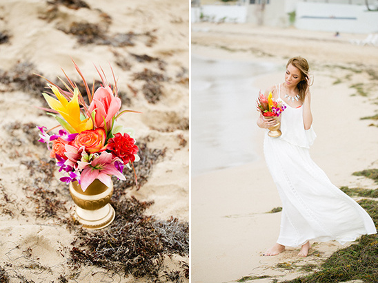 Beach bride with colorful tropical flowers by ocean