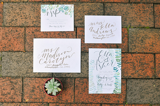 Wedding stationery with calligraphy and botanical details
