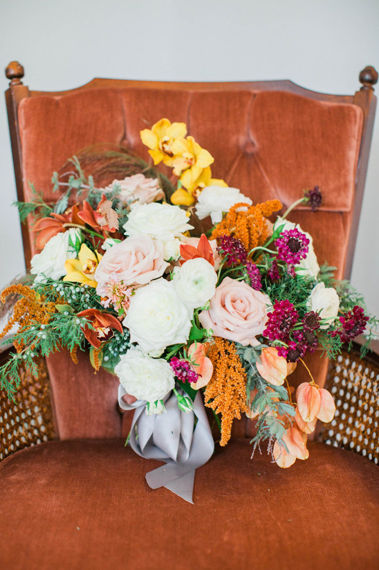 Colorful bouquet on velvet chair for special event