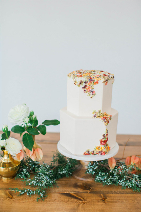Elegant two-tiered wedding cake with floral accents