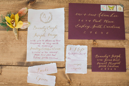 Elegant wedding stationery suite with burgundy and gold calligraphy