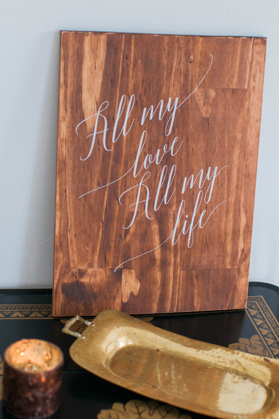 Wooden sign reads All my love All my life artfully displayed