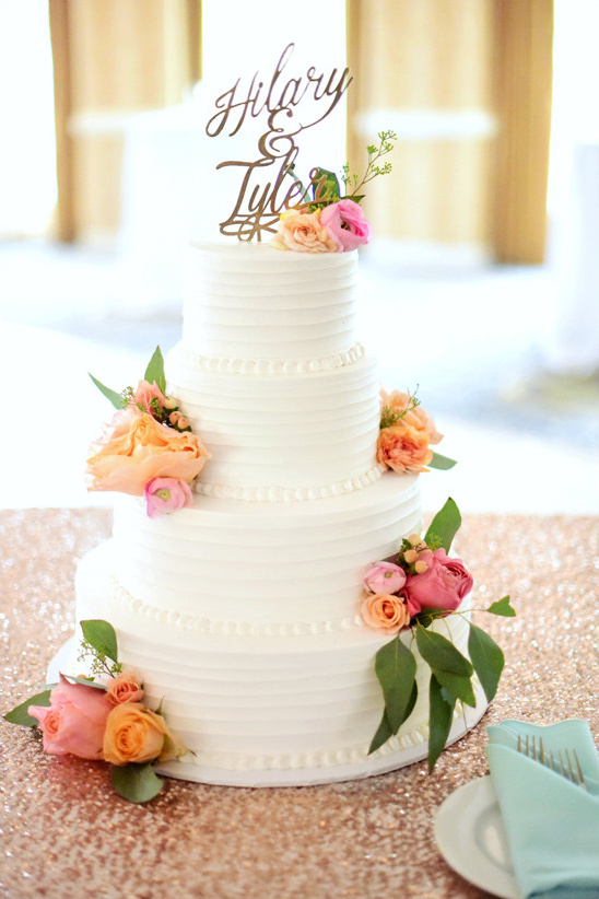 flower topped cake @weddingchicks