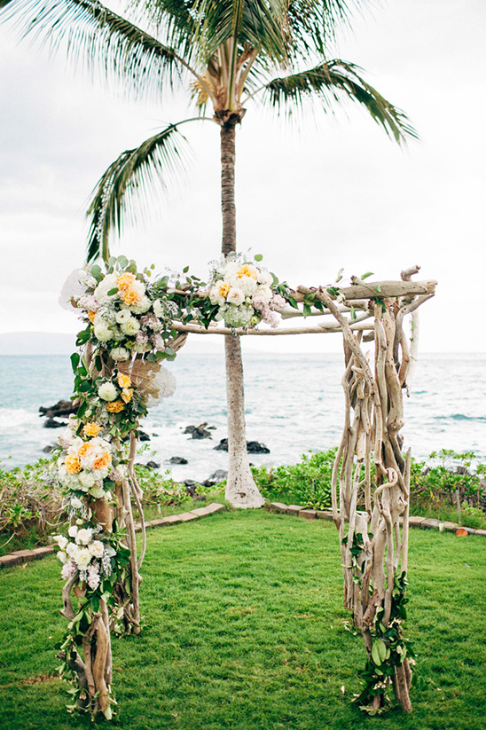 flower covered wood wedding arch @weddingchicks