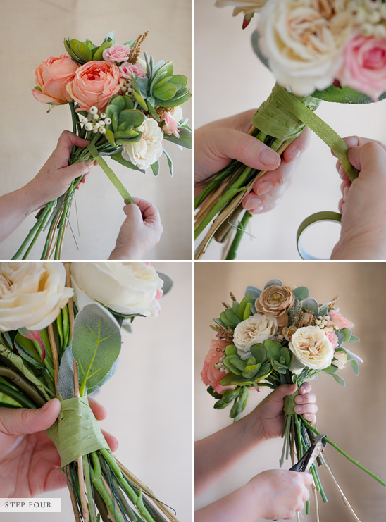 A hand tying a floral bouquet with green ribbon