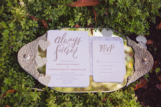 Wedding invitations with romantic always and forever on a silver tray
