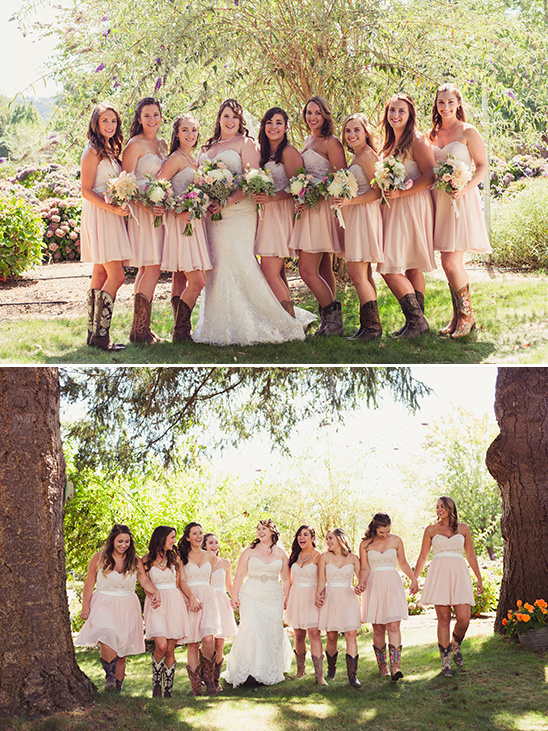 Bridesmaids in pink dresses and boots at a wedding