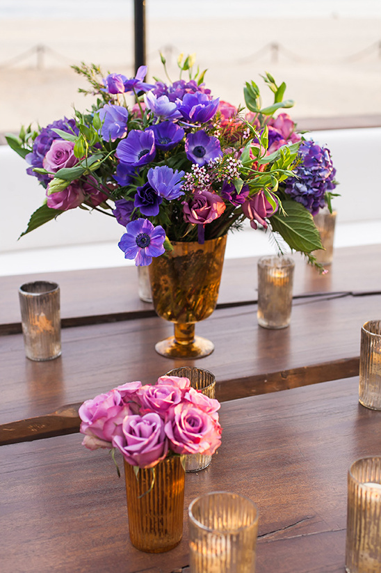 purple flower centerpiece @weddingchicks