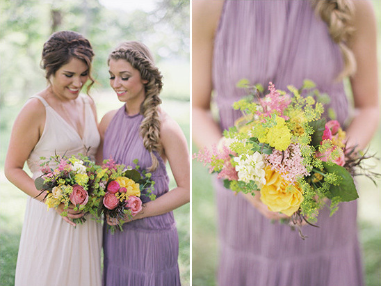 Bridesmaids with flower bouquets and braided hairstyles at wedding