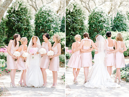 Bride and bridesmaids in pink dresses at outdoor wedding
