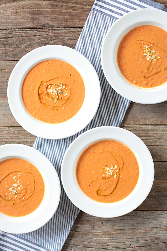 Delicious tomato soup bowls on rustic wood table