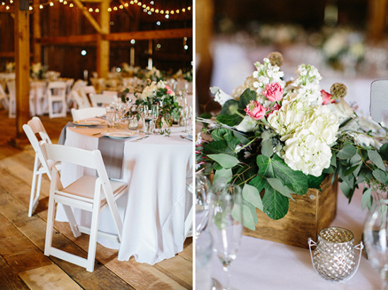 Rustic barn wedding reception with floral centerpieces