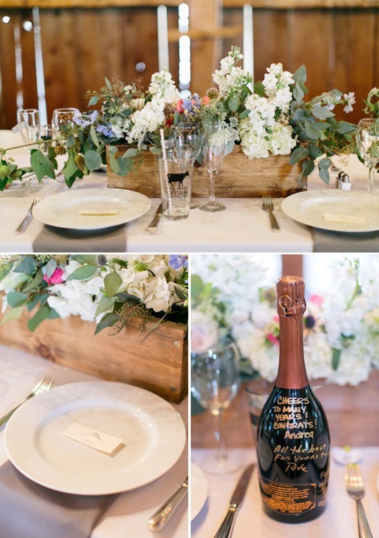 Rustic wedding table setting with flowers and champagne