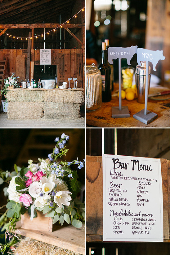 Rustic barn wedding bar with drink menu and flowers