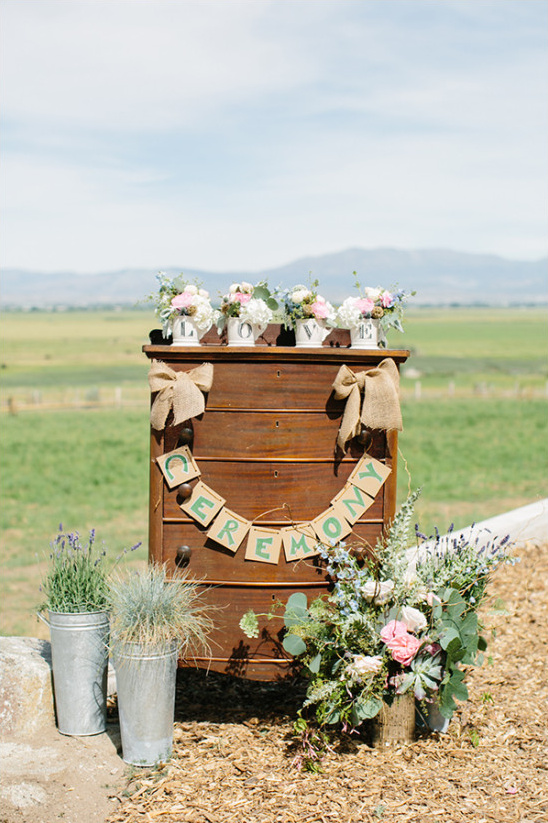 Rustic wedding ceremony altar with flowers outdoors