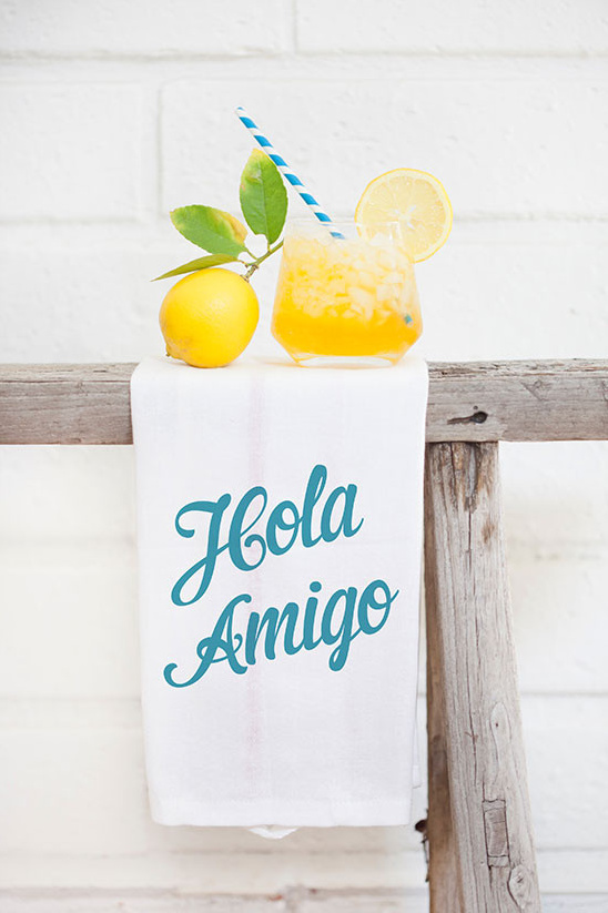 Summer lemon drink with Hola Amigo towel and straw