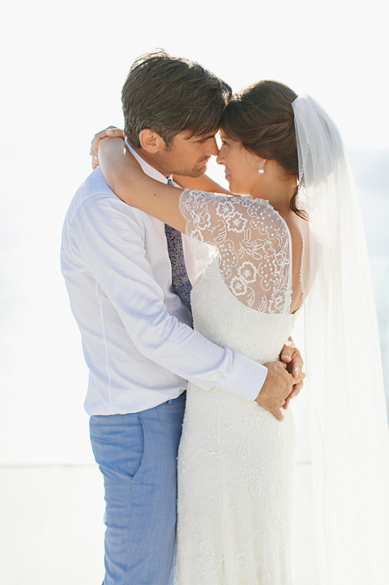 Bride and groom embrace on their wedding day