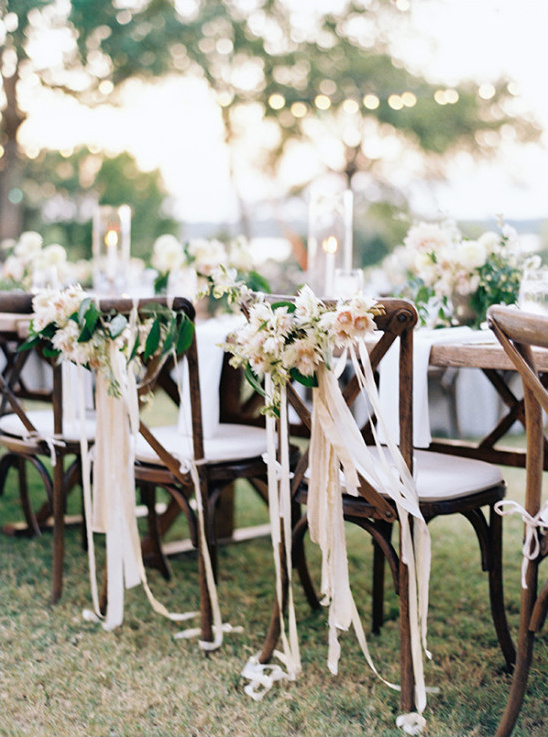 flower and ribbon chair garlands @weddingchicks