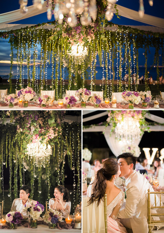 twinkle lights and flower garland wedding party table backdrop