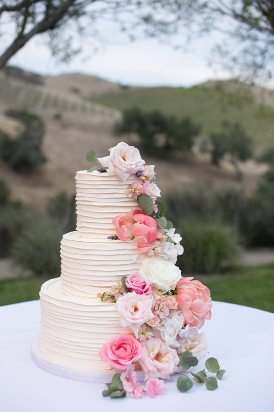 flower topped cake @weddingchicks