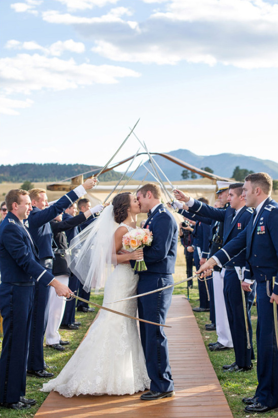 Air Force wedding sword arch kiss outdoor ceremony
