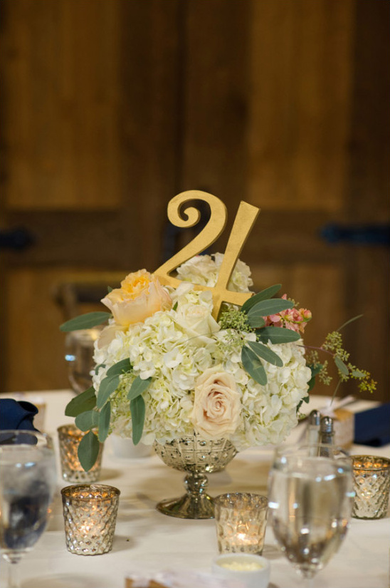Table twentyfour centerpiece with roses and candles