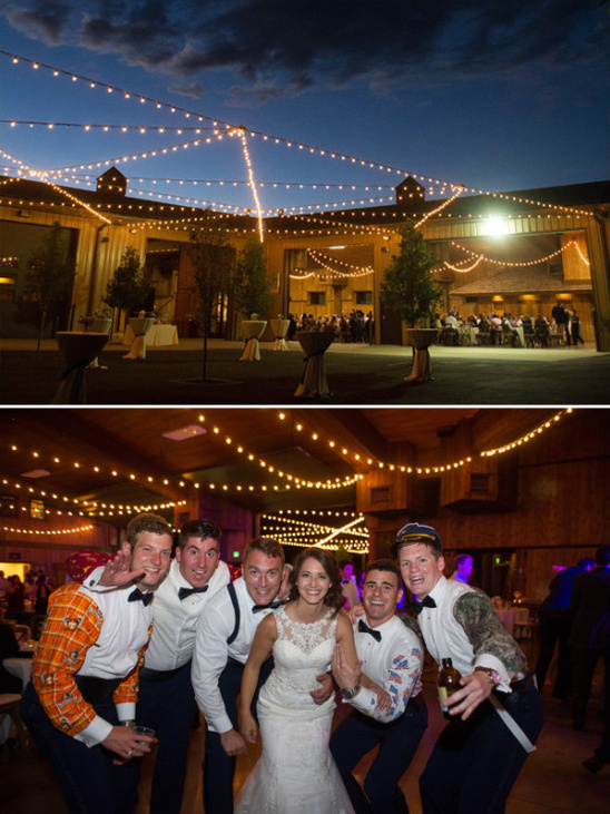 Bride and groomsmen at barn wedding with string lights