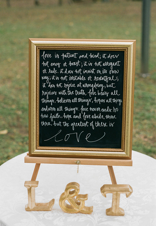 Wedding love poem sign on easel with L and T letters