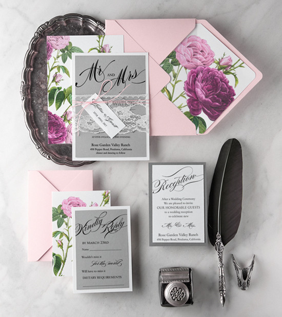 Elegant rose themed wedding invitations suite flatlay
