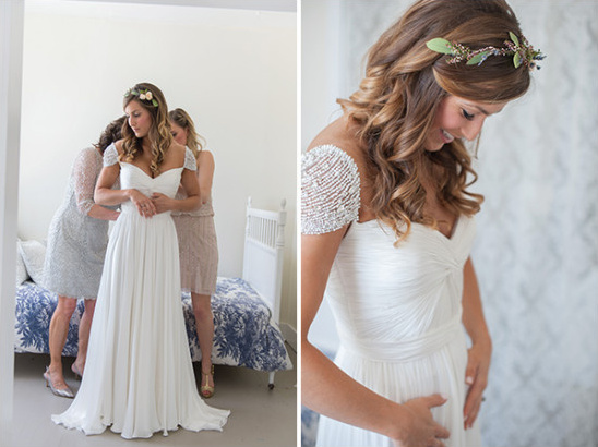 Bride getting ready in flowing white beaded wedding dress