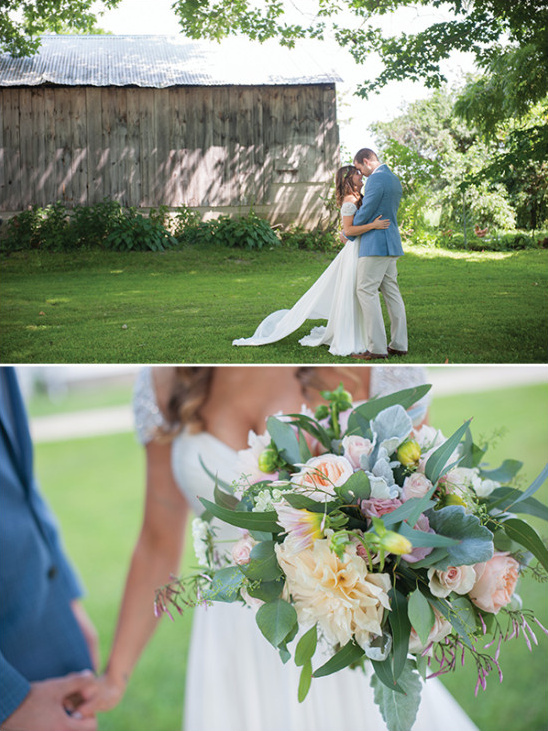 Bride and groom with bouquet at barn wedding venue