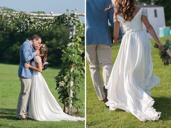 Bride and groom kissing at outdoor wedding altar
