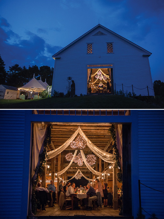 Evening wedding reception in decorated barn venue