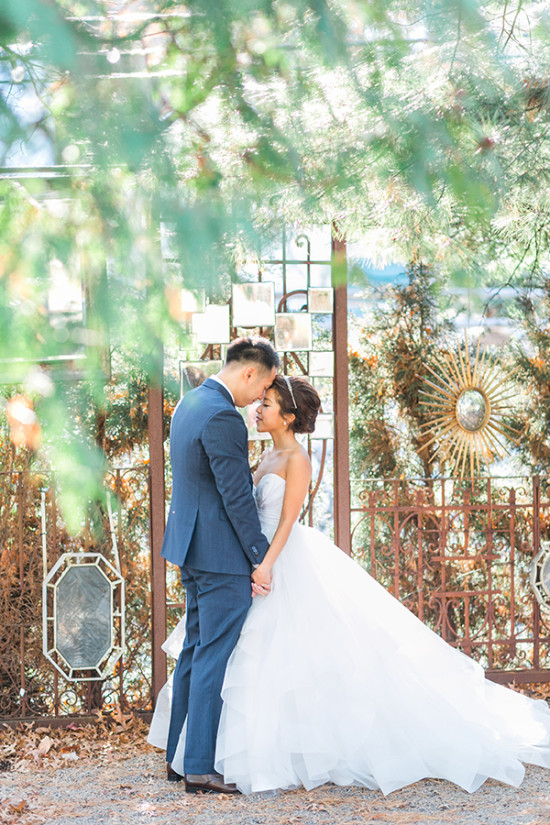 Bride and groom share intimate moment at outdoor wedding
