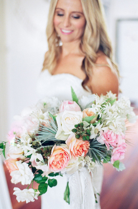 Stunning wedding bouquet with soft peach and pink tones