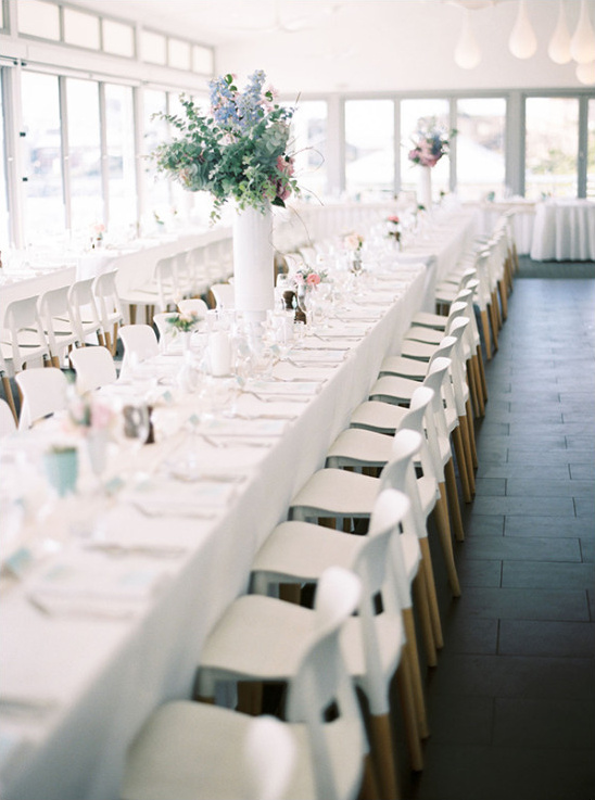 Elegant white reception with minimal pops of color