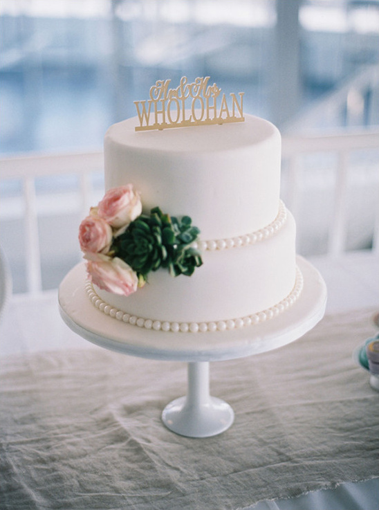 Two tier wedding cake with succulent and pink rose details